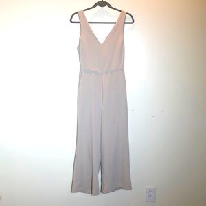 Beautiful Beige jumper with pockets and back out. New with tags.